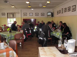 Riders and passengers enjoying their breakfast.